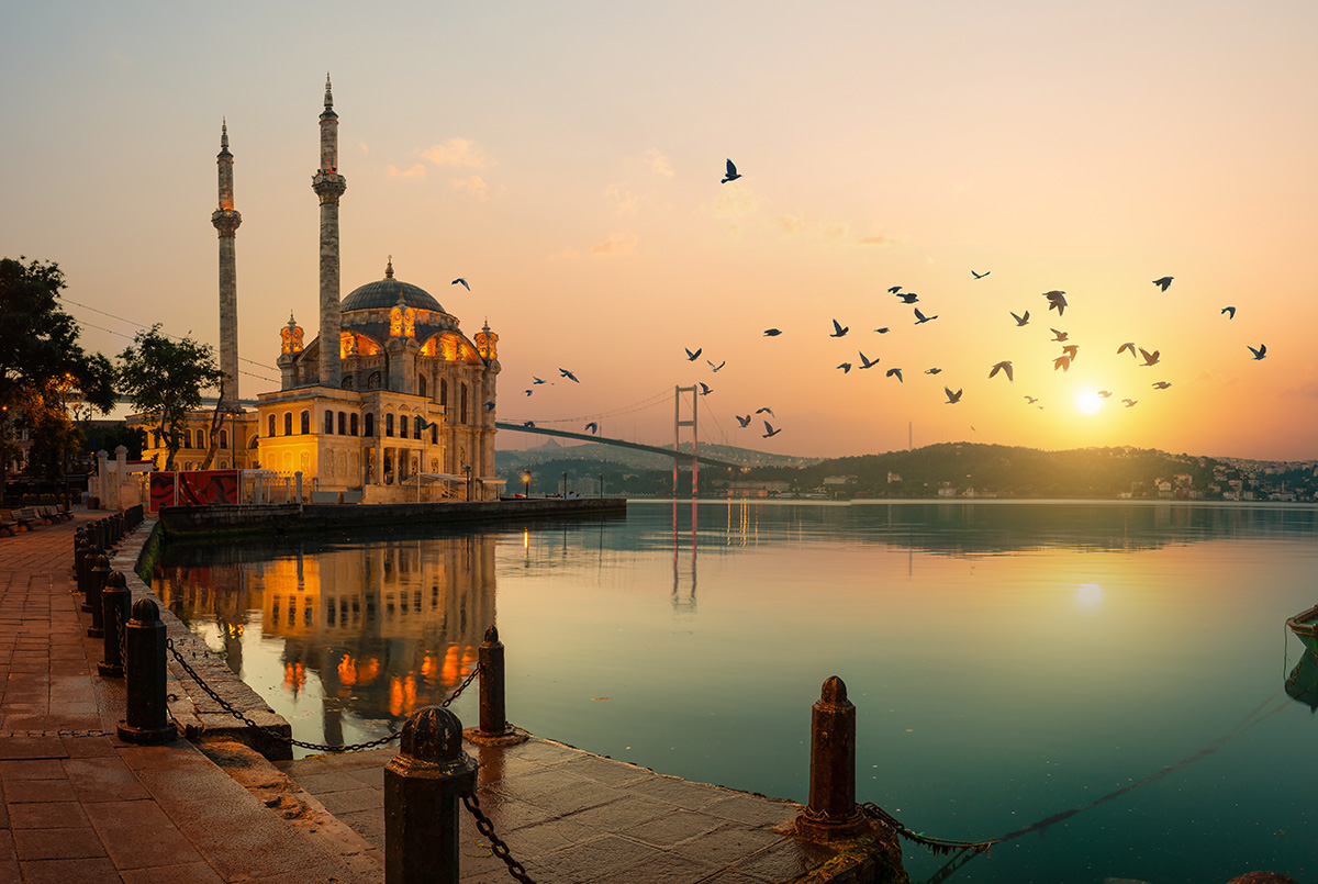 ortakoy mosque and bosphorus bridge in istanbul at sunrise, turkey